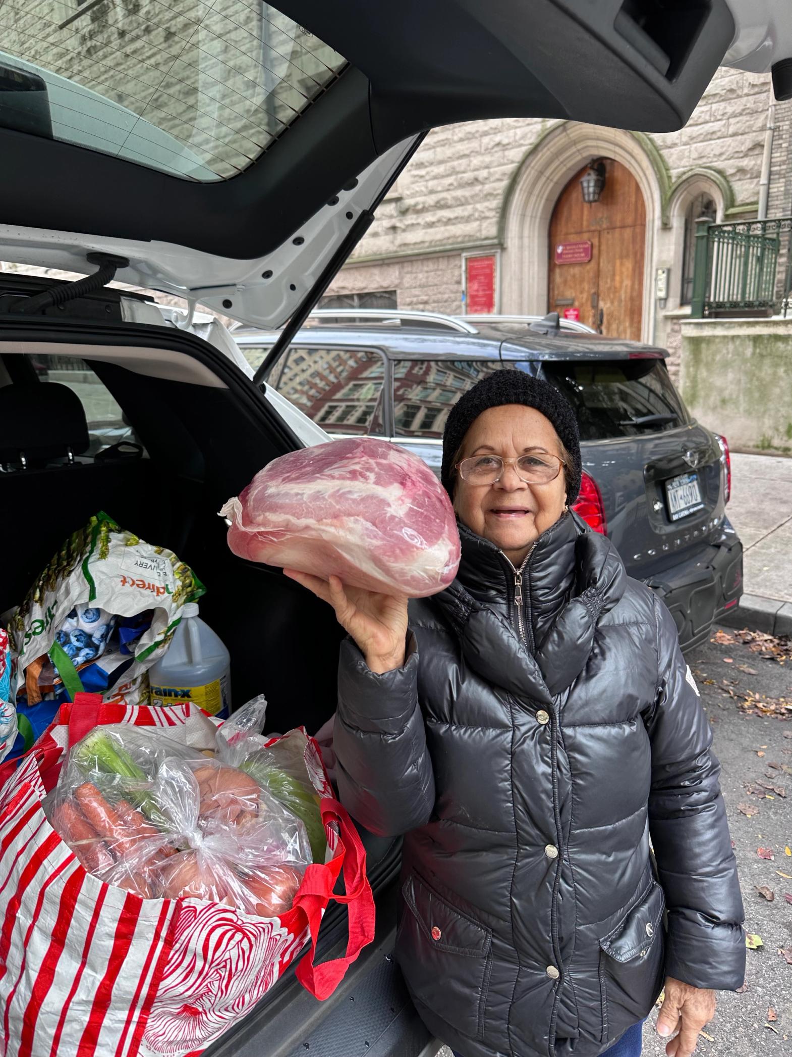 older adult customer with pork shoulder