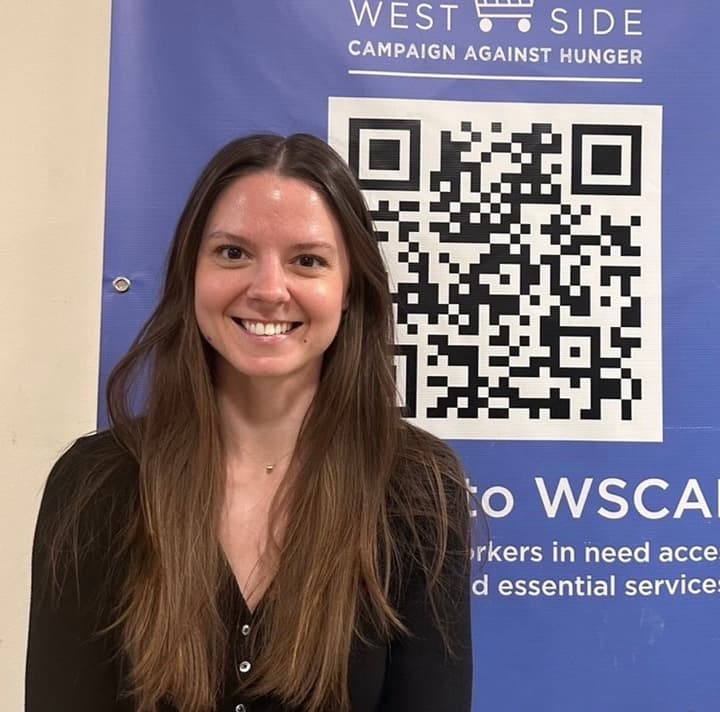 A young, female WSCAH volunteer smiles at the viewer.