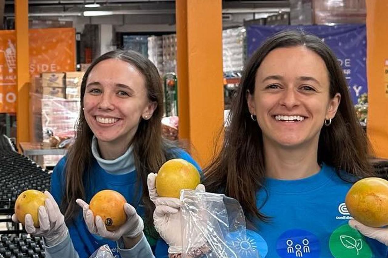 Women holding grapefruits