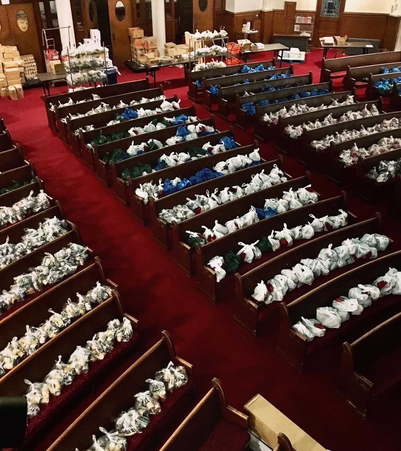 church pews filled with food bags